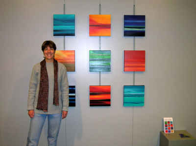Paula Schoen with her paintings. Paula Schoen with her paintings.